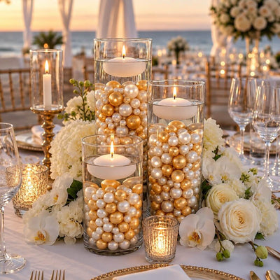 Glass vases filled with off-white and gold pearls and floating candles - thumbnail number 3