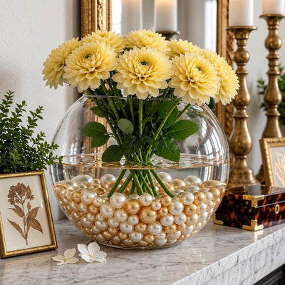 A glass bubble bowl vase with yellow flowers, filled with off-white and gold pearl beads - thumbnail number 6