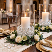 Clear water gel beads fill glass vases around lit candles and floral rings - thumbnail number 5