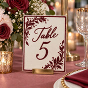 Table 5 sign decorated with burgundy glitter floral designs in a restaurant setup - thumbnail number 2