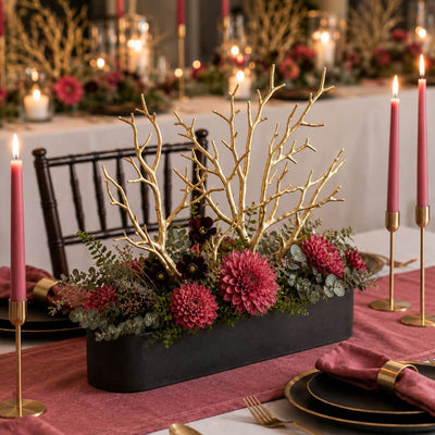 Metallic gold manzanita branches in a long black vase with red flowers and candles - thumbnail number 3