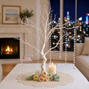 Artificial white manzanita tree centerpiece with hanging crystal chains on a table - thumbnail number 8