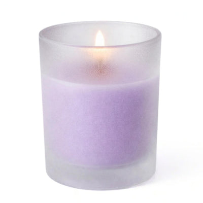 Single lavender candle glowing inside Frosted Votive Holders against white - thumbnail number 2