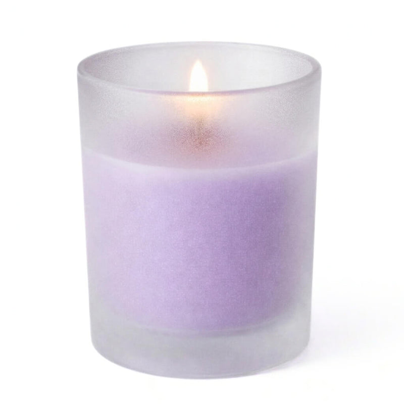 Single lavender candle glowing inside Frosted Votive Holders against white - thumbnail number 2