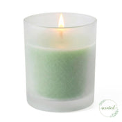 A lit green lime vanilla scented candle glowing smoothly inside Frosted Votive Holders - thumbnail number 2