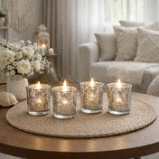 Set of four mercury glass votive candles glowing on a woven tray in a cozy living room - thumbnail number 9