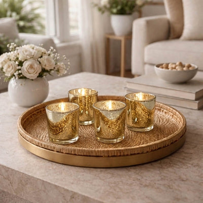 Gold mercury glass votive candles on woven tray in a cozy modern living room - thumbnail number 9