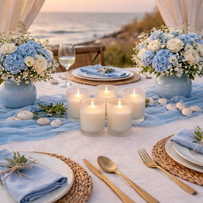 Five lit ivory candles in Frosted Votive Holders on a coastal beach wedding table setting - thumbnail number 7