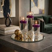 Three purple floating candles in glass cylinders with gold decor objects - thumbnail number 3