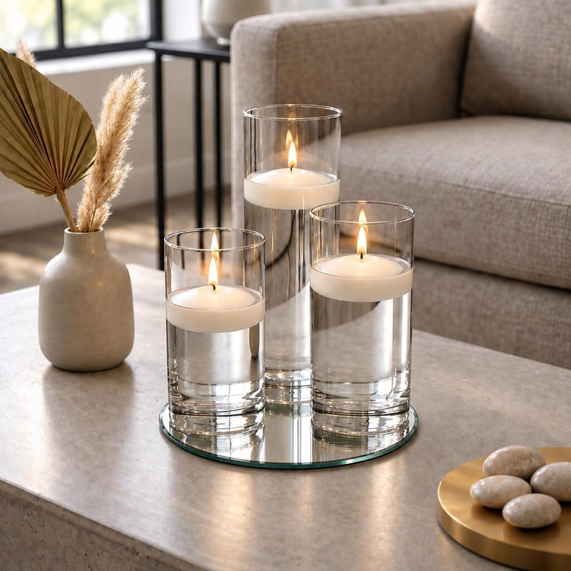 Three lit floating candles in glass cylinder vases on a round mirror tray - thumbnail number 8