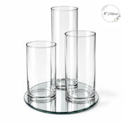 Three empty glass cylinder vases arranged on an eight-inch round mirror tray - thumbnail number 1