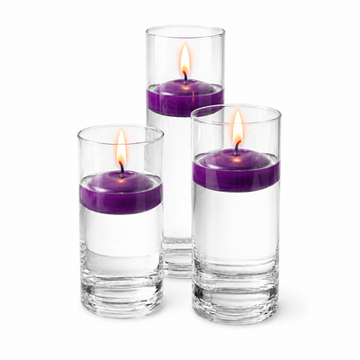 Three purple floating candles burning inside tall clear glass vases - thumbnail number 2