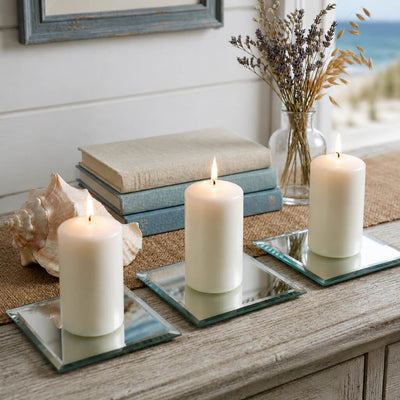 5" Square Mirror Coasters holding lit white pillar candles on a coastal-themed table - thumbnail number 7