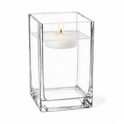 A lit floating candle in a Square Vase 6" isolated on a white background - thumbnail number 3