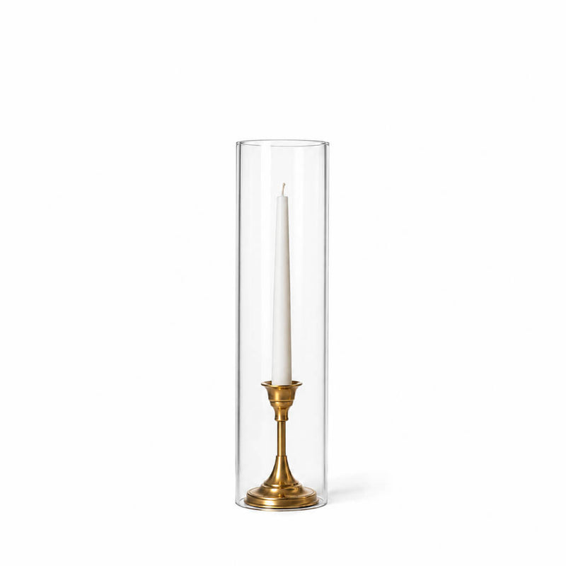 A white taper in a gold holder with a 4" x 16" chimney glass candle shade - thumbnail number 2