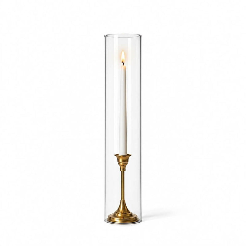 A lit white taper in a gold holder with a 4" x 18" chimney glass candle shade - thumbnail number 3
