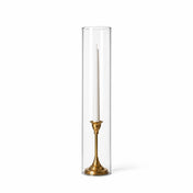 A white taper in a gold holder with a 4" x 18" chimney glass candle shade - thumbnail number 2