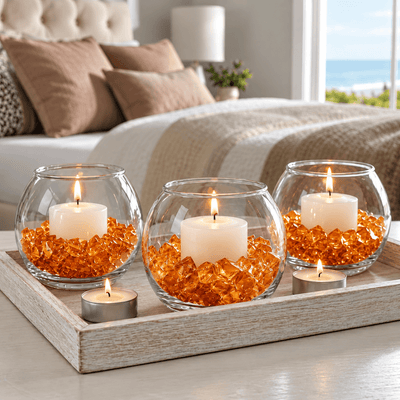 Three glass bowl vases with lit candles surrounded by orange acrylic ice beads on a tray - thumbnail number 5