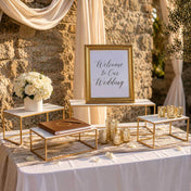 White rectangular acrylic display stands with gold frames on a wedding welcome table - thumbnail number 4