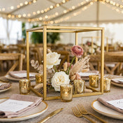 Gold square geometric frame centerpiece with flowers and candles on a rustic wedding table - thumbnail number 4