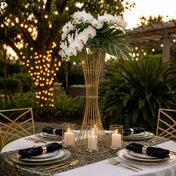 36-inch gold metal centerpiece stand with orchids on a table set for an outdoor event - thumbnail number 2