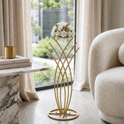 Gold metal mermaid tail flower stand holding a floral arrangement in a living room - thumbnail number 6