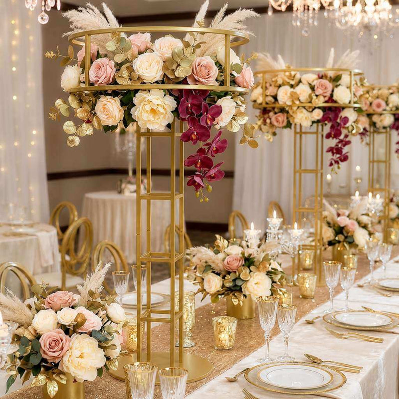 Gold metal floral risers holding elaborate floral arrangements at a wedding reception - thumbnail number 3