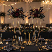 Gold geometric stands with dark floral wedding centerpieces on black table - thumbnail number 4