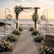 Black and white French toile paper lanterns hanging on shepherd hooks at a beach wedding ceremony - thumbnail number 4