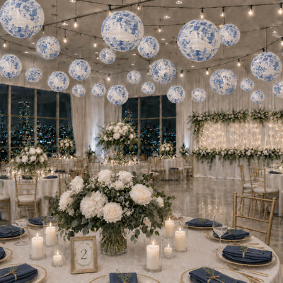 Blue floral paper lanterns hang over an elegant wedding reception ballroom - thumbnail number 3
