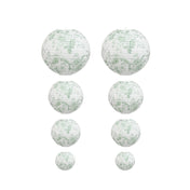 Set of white paper lanterns with green floral print in various sizes on white background - thumbnail number 1