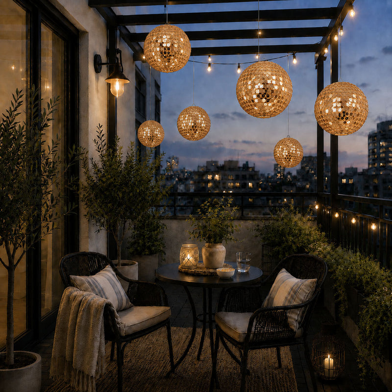 Hanging gold sequin lanterns illuminating a cozy apartment balcony at dusk - thumbnail number 7