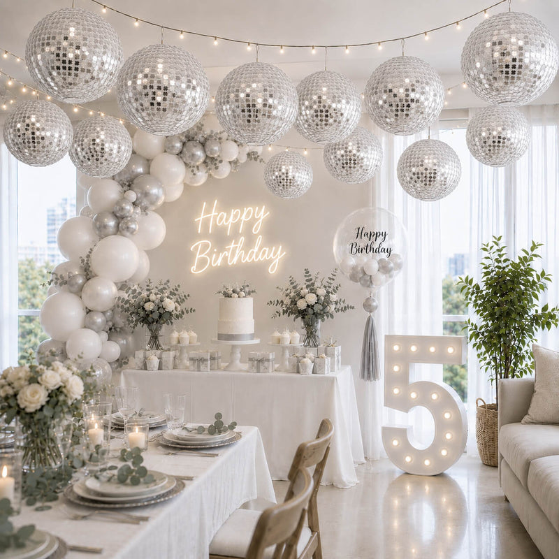 Hanging silver payette sequin lanterns glowing over a festive birthday party - thumbnail number 2