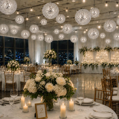 Hanging silver payette sequin lanterns illuminating a grand wedding reception ballroom - thumbnail number 6