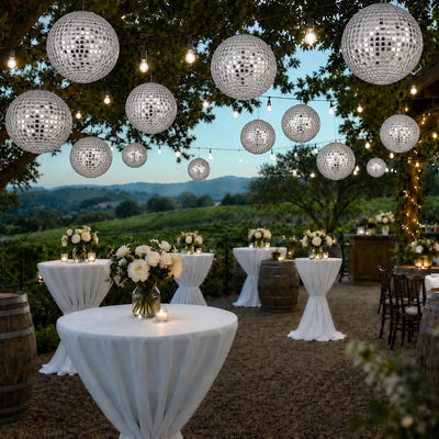 Hanging silver payette sequin lanterns illuminating an outdoor evening event - thumbnail number 5