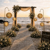 Gold sequin lanterns displayed on stands along a beach wedding archway - thumbnail number 4