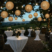Hanging gold sequin lanterns illuminating an outdoor evening event - thumbnail number 5