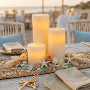 Assorted glowing flameless LED pillar candles on decorated outdoor beach table - thumbnail number 3