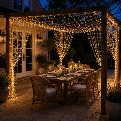 10ft by 10ft warm white LED curtain string lights decorating a wooden pergola over an outdoor dinner - thumbnail number 8