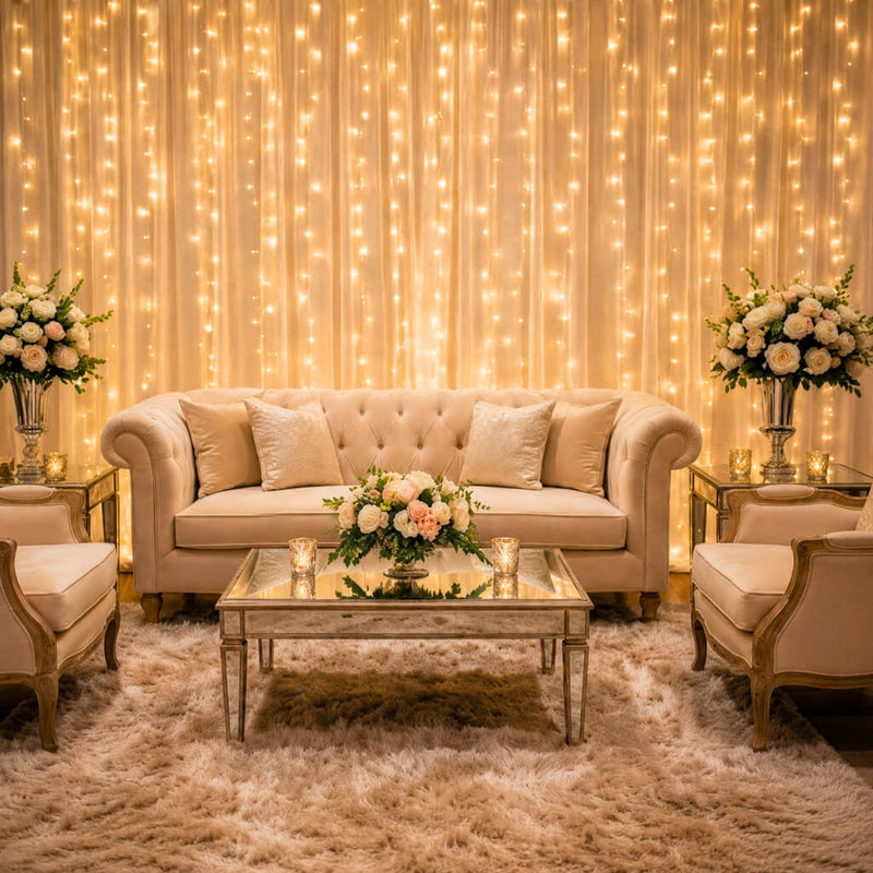Warm white LED curtain lights draped as a backdrop for a cozy, elegant living room seating area - thumbnail number 11