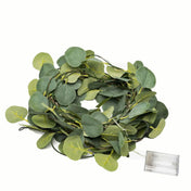 Coiled green eucalyptus leaf garland string lights with a battery box - thumbnail number 1