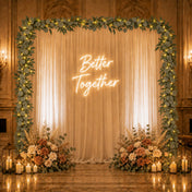 Eucalyptus LED garland frames a backdrop with a neon sign - thumbnail number 5