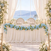 Blue jasmine flower garland with fairy lights decorating a wedding table - thumbnail number 4