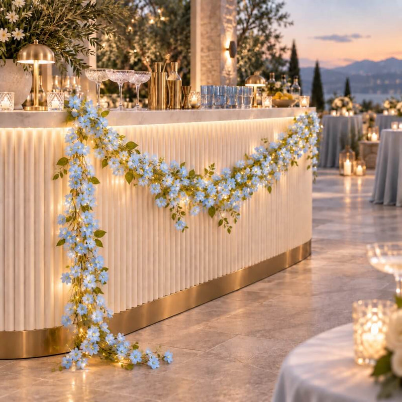 Blue jasmine flower garland with fairy lights decorating a bar counter - thumbnail number 7