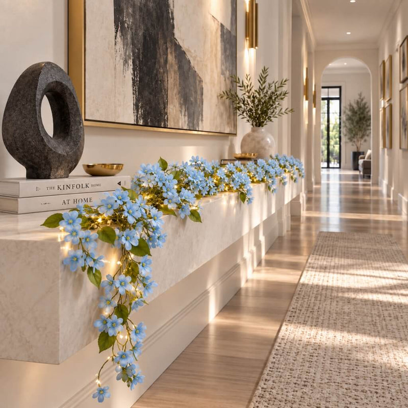 Blue jasmine flower garland with fairy lights on a hallway console table - thumbnail number 10