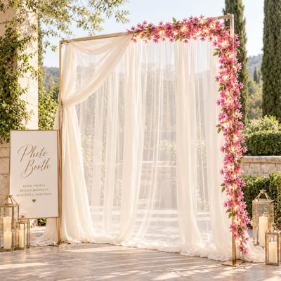 Pink jasmine LED garland framing an outdoor wedding photo booth - thumbnail number 4