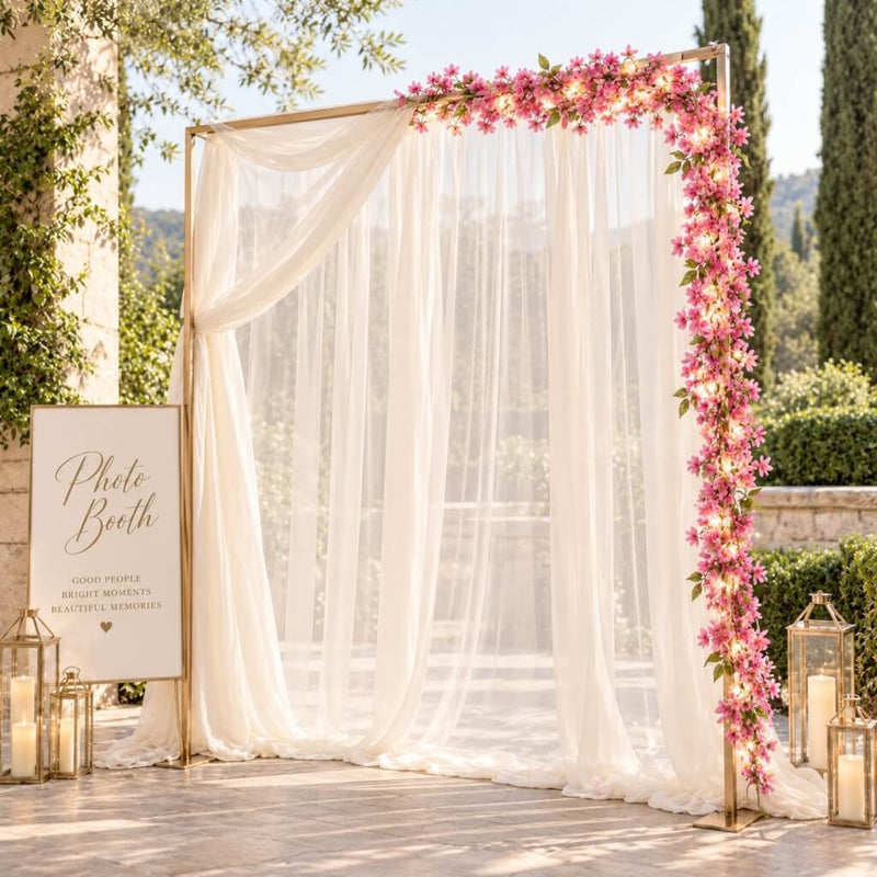 Pink jasmine LED garland framing an outdoor wedding photo booth - thumbnail number 4