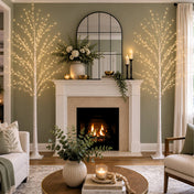 Two 6ft lighted birch trees with warm white LEDs flanking a fireplace in a cozy living room - thumbnail number 9