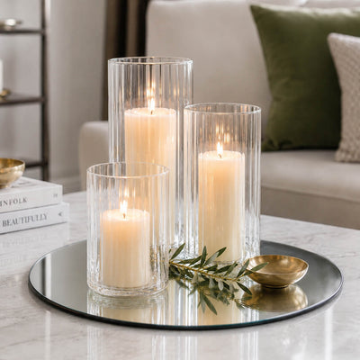 Three lit pillar candles in fluted glass holders on a 14" round mirror glass - thumbnail number 7