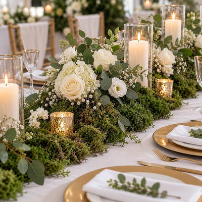 Wedding table runner featuring preserved green reindeer moss, white roses, and candles - thumbnail number 2